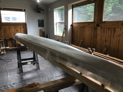  1/4/19 - Fiberglass cloth is draped over the hull. 