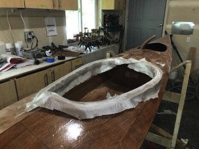  4/23/20 - Fiberglass cloth is laid on the coaming lip. 