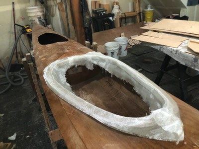  4/23/20 - Fiberglass cloth is laid on the coaming lip. 