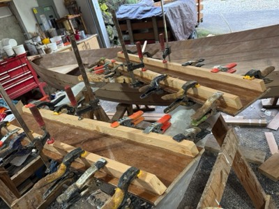  3/25/25 - Stiffeners are epoxied to the undersides of the thwarts.  