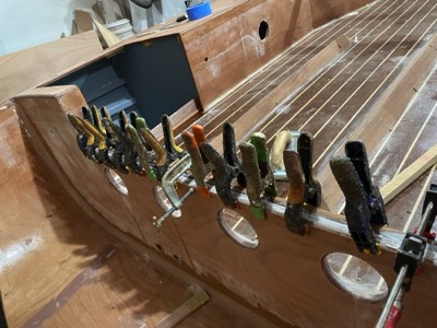  Hardwood transom reinforcement is epoxied in place. 