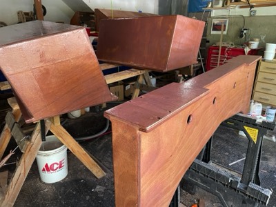  7/27/21 - Trailer bunks are given several fill coats of epoxy. 