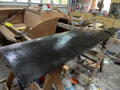  4/23/22 - A layer of 12 oz carbon fiber is added. 